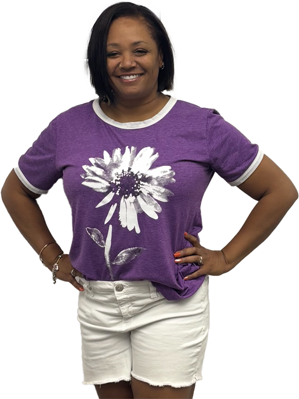 Home 136 Happy Namaste Skincare & Wellness client wearing a branded purple shirt, showing confidence and positive results from her treatment in Las Vegas