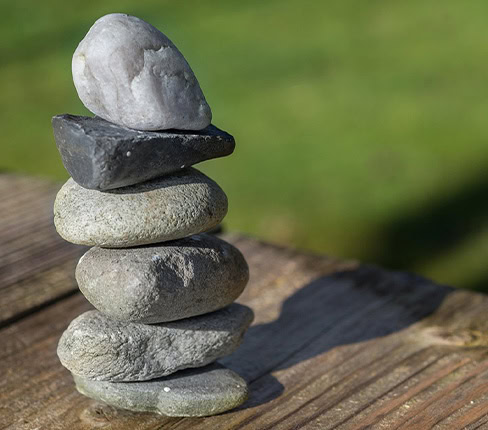 Stacked stones representing balance and calm at Namaste Skincare & Wellness.